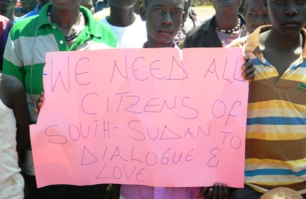 Children hold banners during the Visit of First Vice president Taban Deng Gai to Yei last week